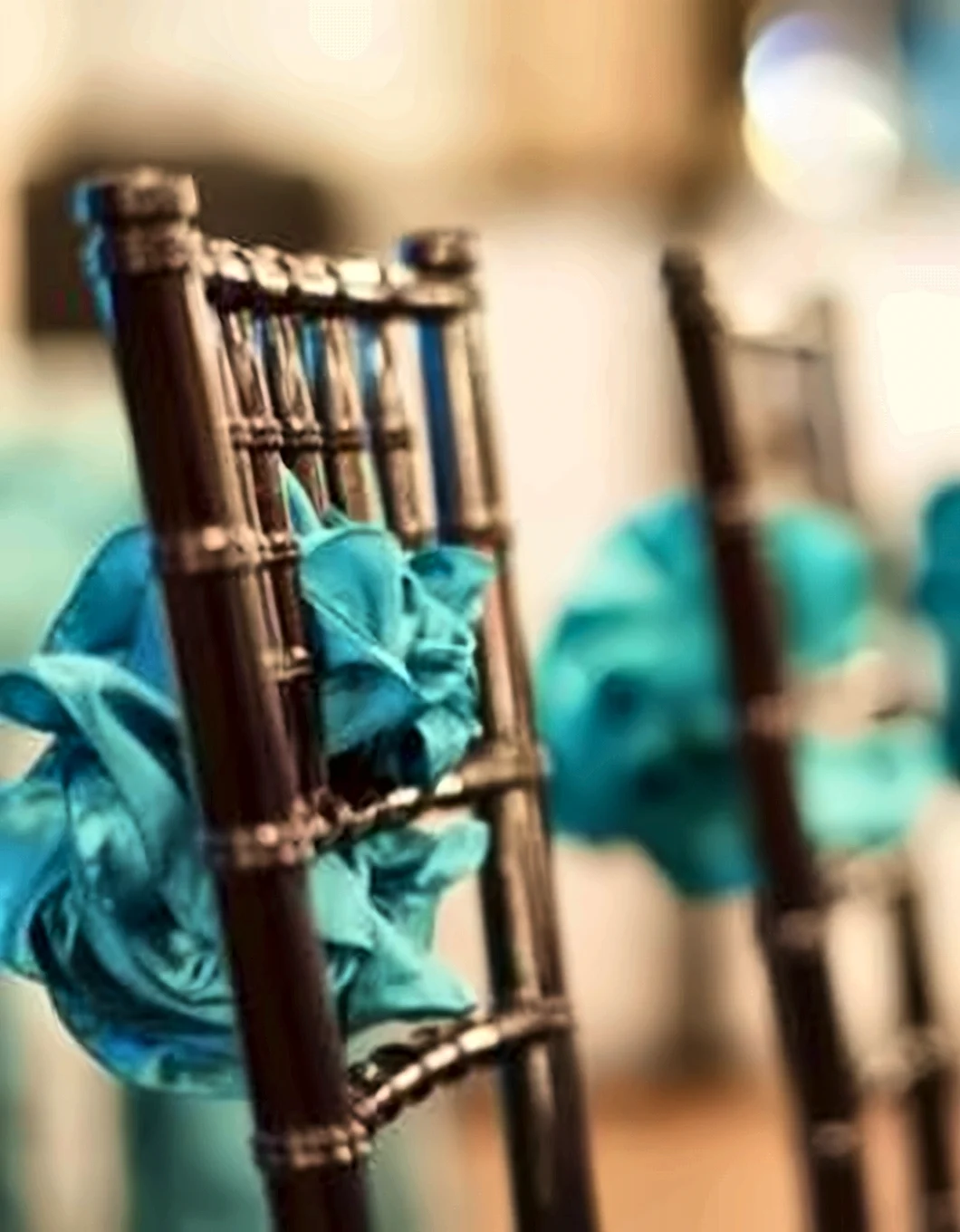 Chair dressed with a teal bow