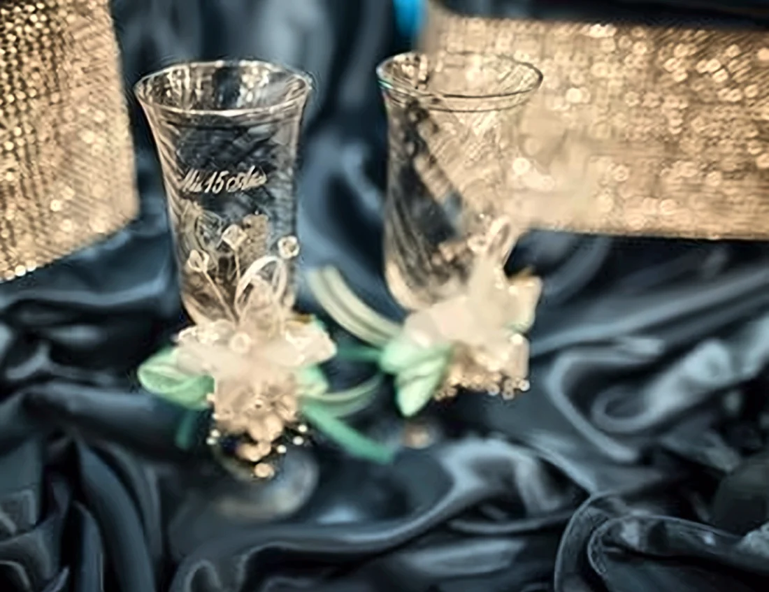 Quinceañera toasting glasses